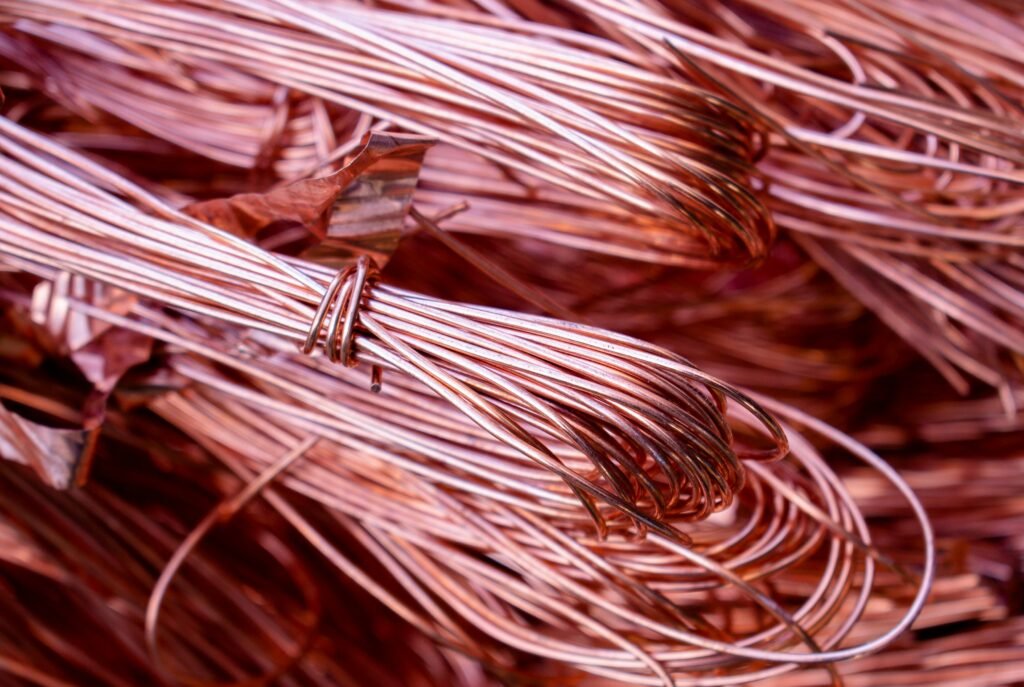 Detailed view of copper wires showcasing metallic texture and recycling theme.