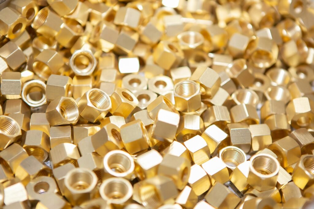 A detailed image showcasing a pile of shiny golden nuts, highlighting their metallic texture.